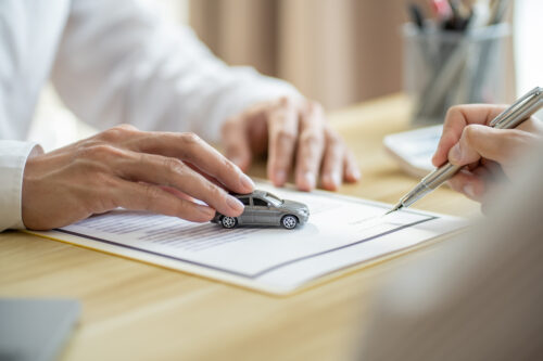 Loss Adjuster Insurance Agent Inspecting Damaged Car.